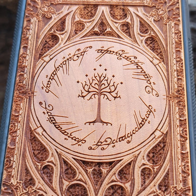 Gothic design wood phone case featuring intricate laser-engraved patterns inspired by Lord of the Rings. Compatible with iPhone , iPhone 15, 14, 13, 12, 11 Pro Max Mini, and Samsung Galaxy S, S24, S23, S22, S21, S20 Ultra, Plus, Note 20. Durable, slim, and stylish for Tolkien fans.