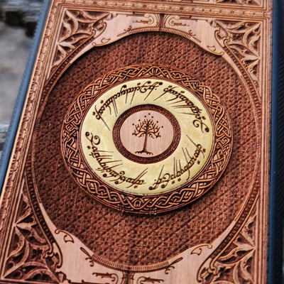 Wooden phone case featuring a gothic Lord of the Rings-inspired design, intricately laser-engraved with the iconic Eye of Sauron and Elvish script. The detailed engraving brings a dark, elegant touch to your phone, capturing the essence of Tolkien’s Middle-earth. Compatible with iPhone , 15, 14, 13, 12, 11 Pro Max Mini and Samsung Galaxy S, S24, S23, S22, S21, S20 Ultra, Plus, Note 20. A perfect, durable accessory for fans of the Lord of the Rings saga.