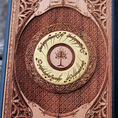 Hand-finished cherry wood phone case featuring an engraved Lord of the Rings design, perfect for iPhone & Galaxy users.
