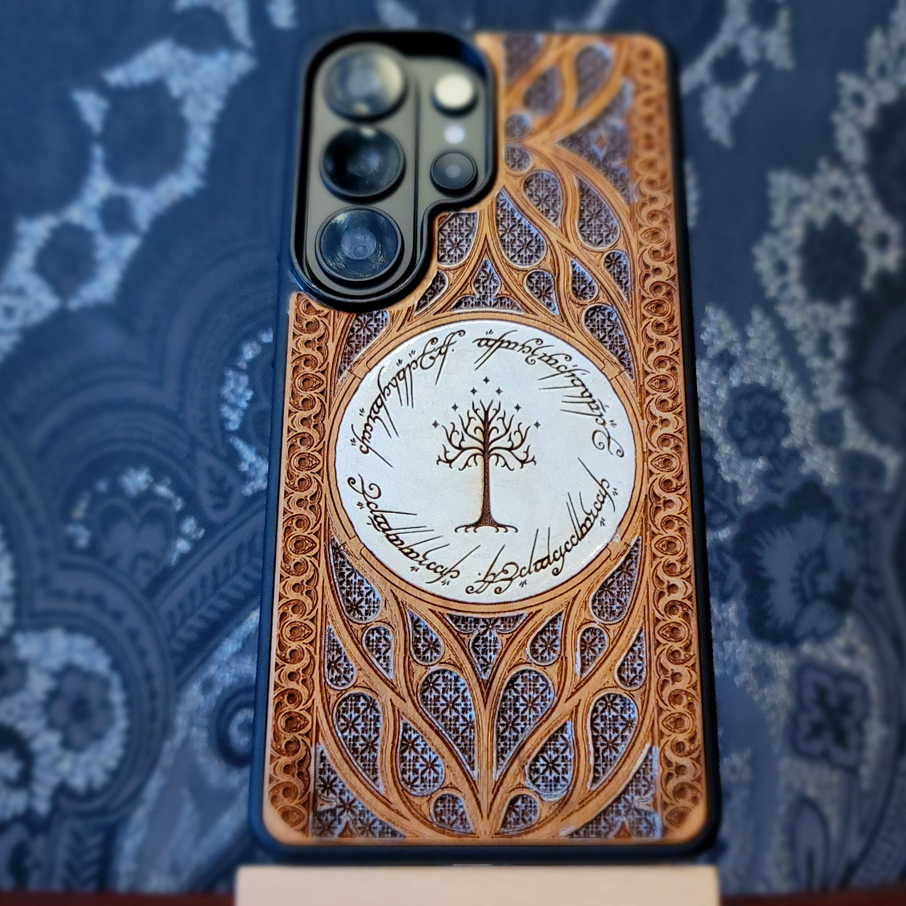 Wooden phone case for iPhone and Samsung Galaxy featuring a runic inscription and Gothic pattern design, laser-engraved for a unique look. Slim, durable, and compatible with iPhone 17, 16, 15, 14, 13, 12, 11 Pro Max Mini, and Samsung Galaxy S26, S25, S24, S23, S22, S21, S20 Ultra, Plus, Note 20. Order now for a stylish and functional phone upgrade!