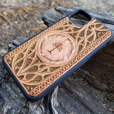 Lord of the Rings wood phone case featuring the White Tree of Gondor surrounded by Elvish script and intricate, detailed patterns. Laser-engraved with precision and a natural wood finish, this durable case is compatible with iPhone , 15, 14, 13, 12, 11, Pro Max, Mini, and Samsung Galaxy S, S24, S23, S22, S21, S20 Ultra, Plus, Note 20. A stylish and protective accessory for Tolkien fans.