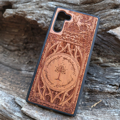 Gothic design wood phone case featuring intricate laser-engraved patterns inspired by Lord of the Rings. Compatible with iPhone , iPhone 15, 14, 13, 12, 11 Pro Max Mini, and Samsung Galaxy S, S24, S23, S22, S21, S20 Ultra, Plus, Note 20. Durable, slim, and stylish for Tolkien fans.