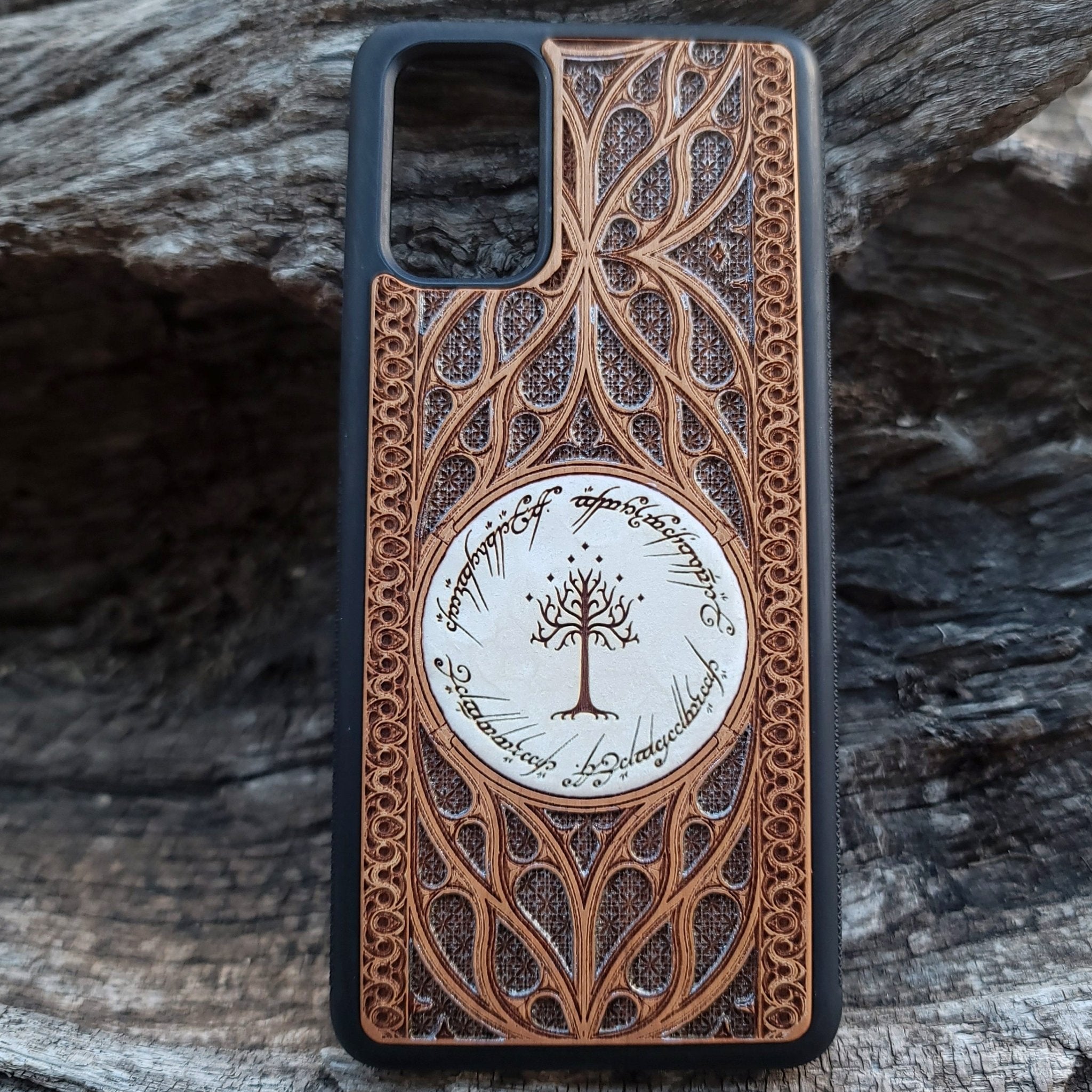 Wooden phone case for iPhone and Samsung Galaxy featuring a runic inscription and Gothic pattern design, laser-engraved for a unique look. Slim, durable, and compatible with iPhone 15, 14, 13, 12, 11 Pro Max Mini, and Samsung Galaxy S24, S23, S22, S21, S20 Ultra, Plus, Note 20. Order now for a stylish and functional phone upgrade!