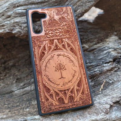 Gothic design wood phone case featuring intricate laser-engraved patterns inspired by Lord of the Rings. Compatible with iPhone , iPhone 15, 14, 13, 12, 11 Pro Max Mini, and Samsung Galaxy S, S24, S23, S22, S21, S20 Ultra, Plus, Note 20. Durable, slim, and stylish for Tolkien fans.