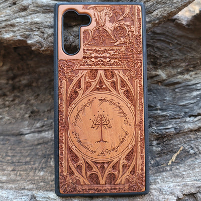 Gothic design wood phone case featuring intricate laser-engraved patterns inspired by Lord of the Rings. Compatible with iPhone , iPhone 15, 14, 13, 12, 11 Pro Max Mini, and Samsung Galaxy S, S24, S23, S22, S21, S20 Ultra, Plus, Note 20. Durable, slim, and stylish for Tolkien fans.