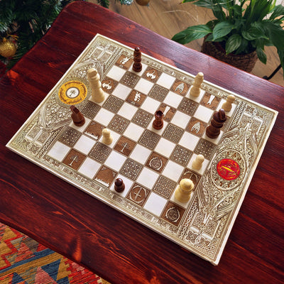 Decorative chessboard with pieces on a wooden table