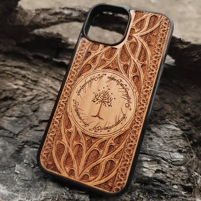Lord of the Rings wood phone case featuring the White Tree of Gondor surrounded by Elvish script and intricate detailing. Laser-engraved for a unique and elegant design, this durable case is compatible with iPhone , 15, 14, 13, 12, 11, Pro Max, Mini, and Samsung Galaxy S, S24, S23, S22, S21, S20 Ultra, Plus, Note 20. Perfect for Tolkien fans seeking a stylish and protective accessory.