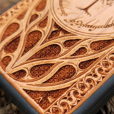 Lord of the Rings wood phone case featuring the White Tree of Gondor surrounded by Elvish script and intricate detailing. Laser-engraved for a unique and elegant design, this durable case is compatible with iPhone , 15, 14, 13, 12, 11, Pro Max, Mini, and Samsung Galaxy S, S24, S23, S22, S21, S20 Ultra, Plus, Note 20. Perfect for Tolkien fans seeking a stylish and protective accessory.