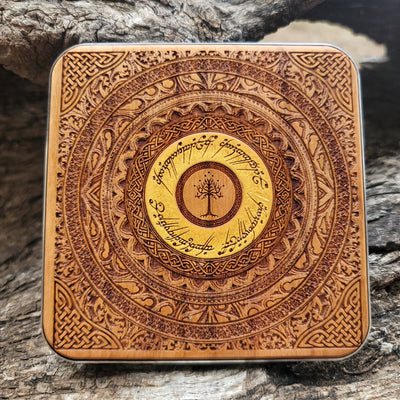 Fantasy desk featuring Lord of the Rings themed wireless charger.