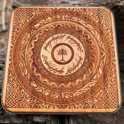 Close-up of glowing elven script from Middle-earth on charger.