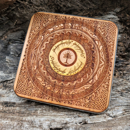 Dark wood wireless charger with glowing Elvish inscription.