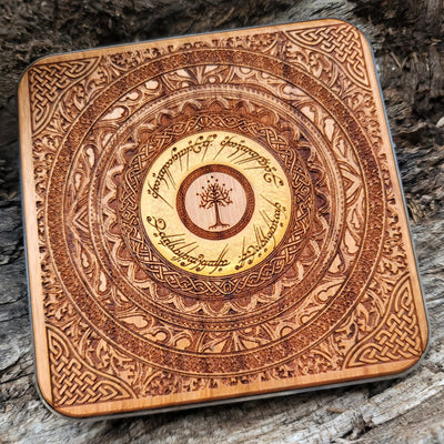Tolkien-inspired elven language painted across wooden charger.