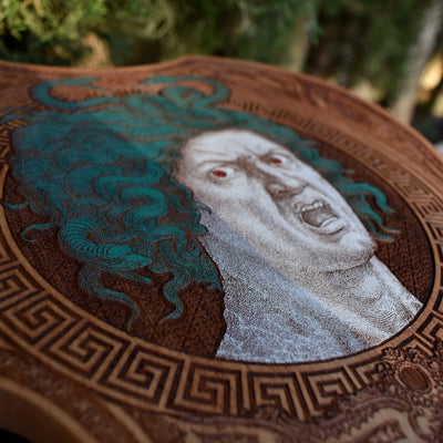 Detailed Medusa engraving on cedar violin-shaped art piece for collectors