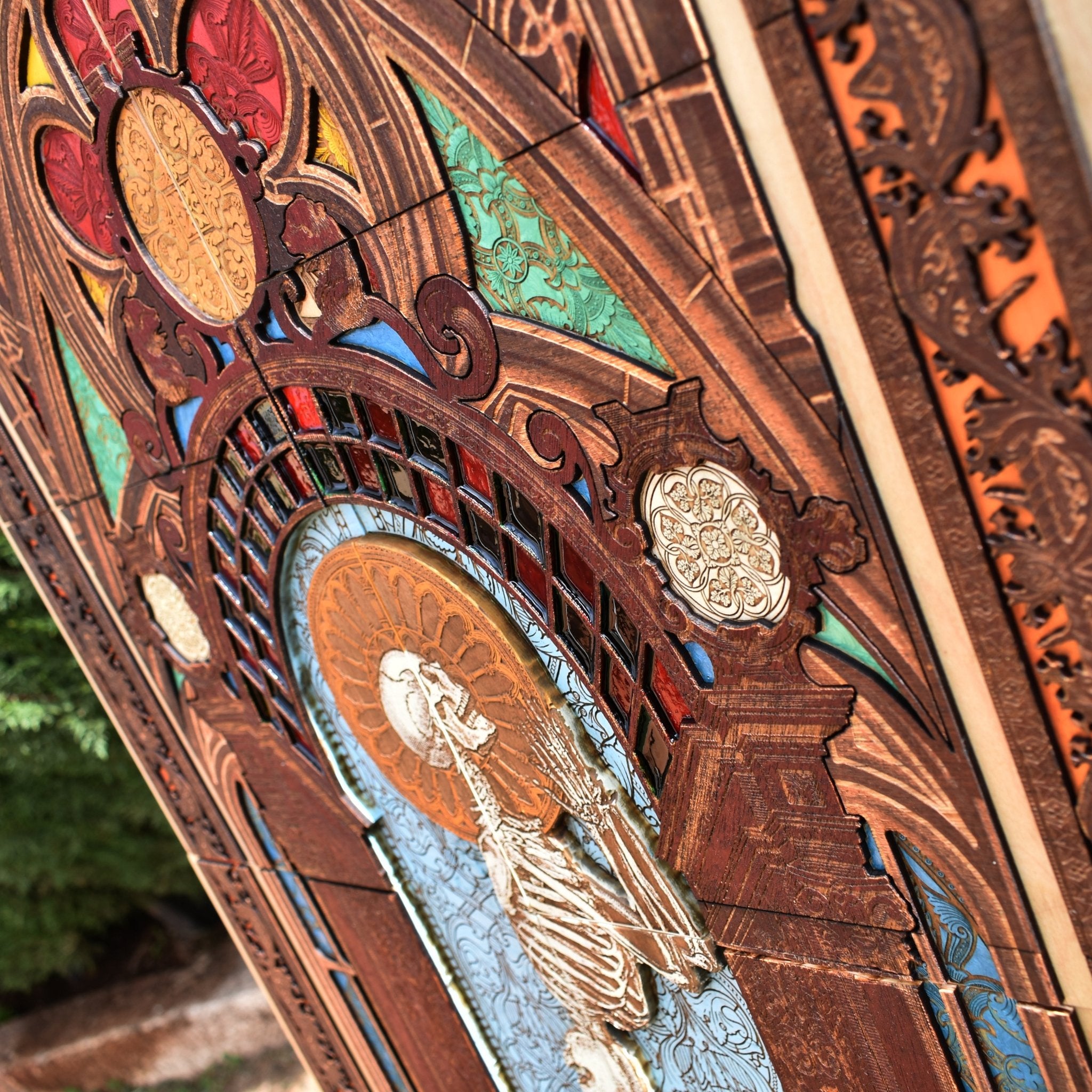 Skeleton kneeling in prayer on engraved wood, perfect for dark or spiritual interiors.
