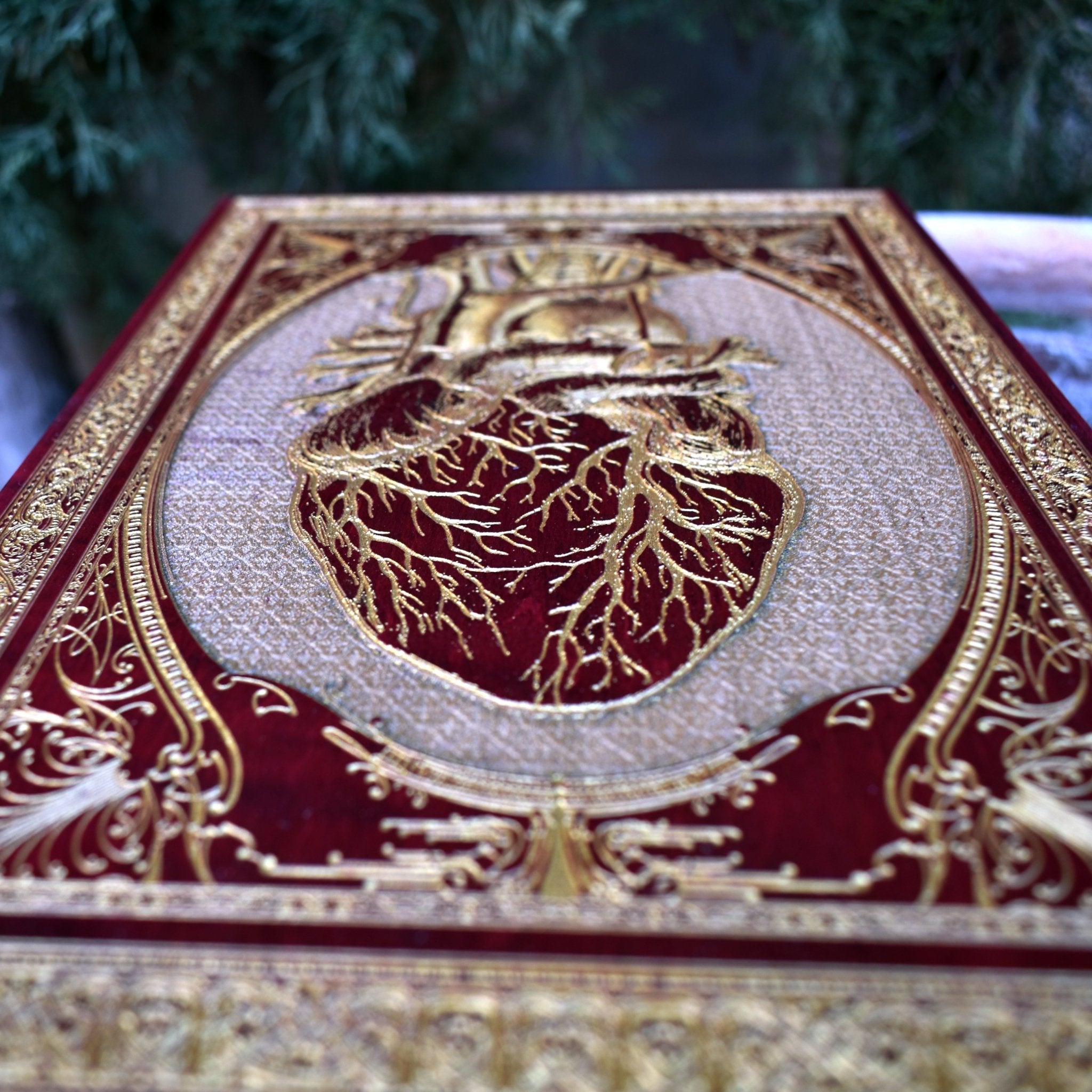 Detailed red anatomical heart wall plaque, handcrafted gothic design.