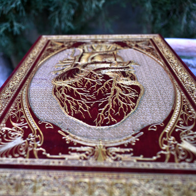 Detailed red anatomical heart wall plaque, handcrafted gothic design.