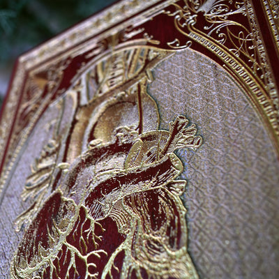 Wood art featuring red human heart engraving, ideal for tattoo studio walls.