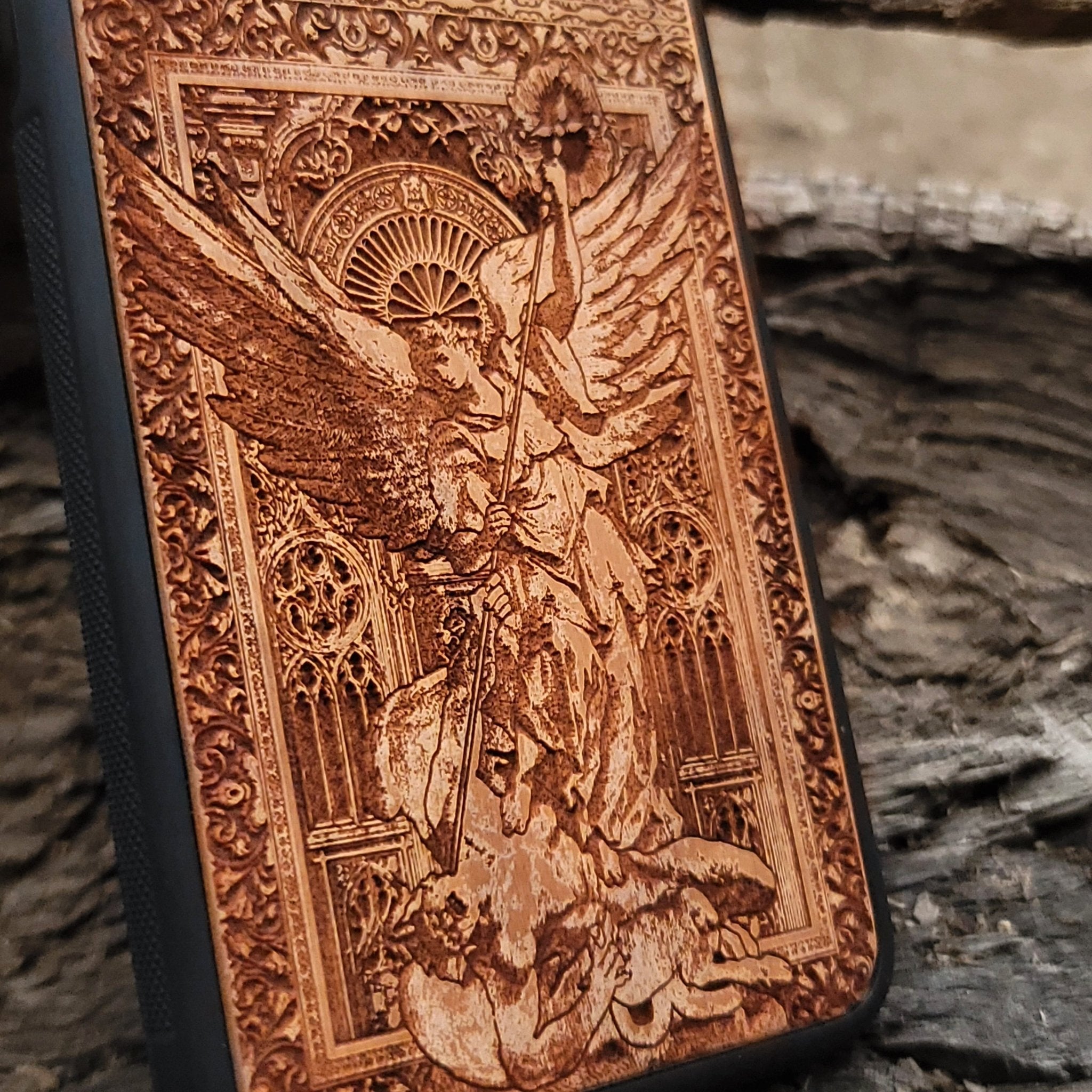 Handcrafted Saint Michael wood phone case, perfect for collectors