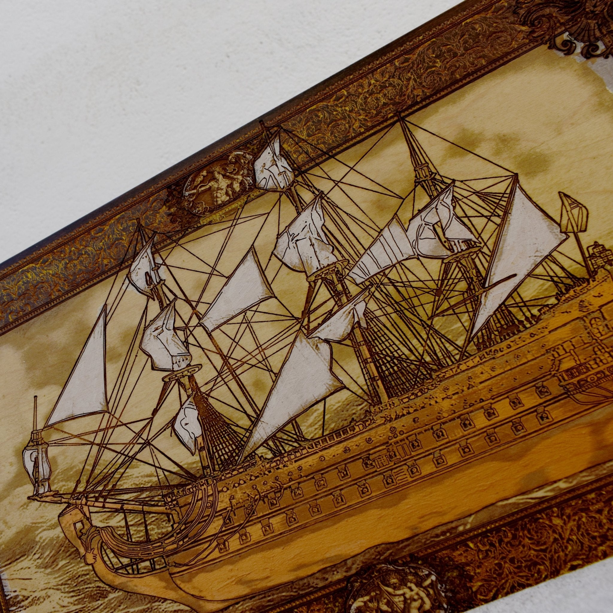 Engraved wooden wall art with detailed sailing ship design, nautical maritime home décor