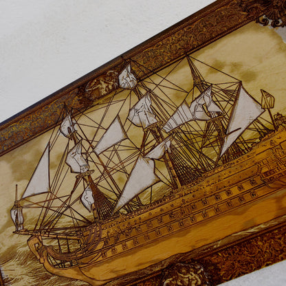 Engraved wooden wall art with detailed sailing ship design, nautical maritime home décor