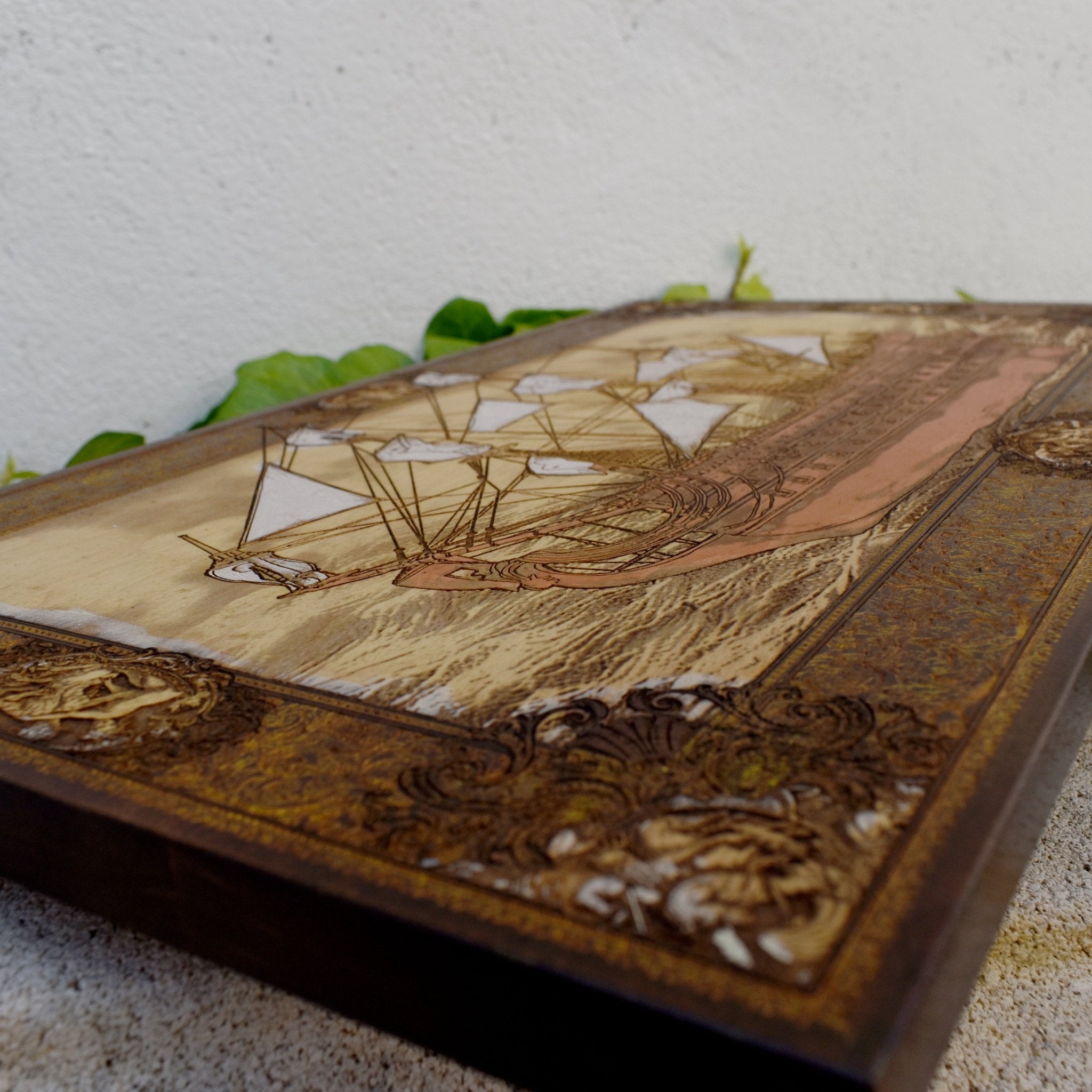 Engraved wooden wall art with detailed sailing ship design, nautical maritime home décor