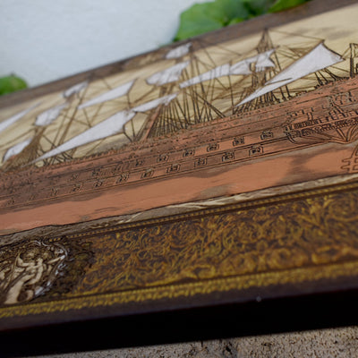 Engraved wooden wall art with detailed sailing ship design, nautical maritime home décor