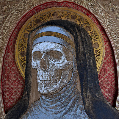 Detailed laser-engraved sister and skull design on maple wood.