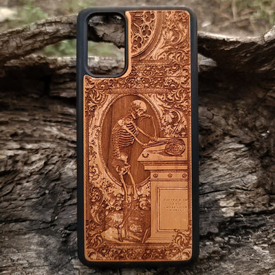 Wooden phone case with a gothic thinking skeleton design, intricately carved for iPhone , iPhone 15, Galaxy S23 Ultra, Note 20, and more. Perfect for gothic art lovers and unique phone accessories.