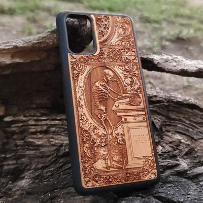 Wooden phone case with a gothic thinking skeleton design, intricately carved for iPhone , iPhone 15, Galaxy S23 Ultra, Note 20, and more. Perfect for gothic art lovers and unique phone accessories.