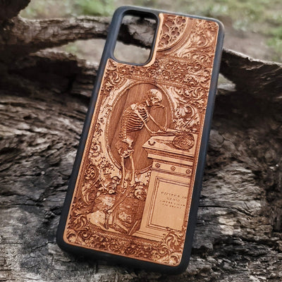 Wooden phone case with a gothic thinking skeleton design, intricately carved for iPhone , iPhone 15, Galaxy S23 Ultra, Note 20, and more. Perfect for gothic art lovers and unique phone accessories.
