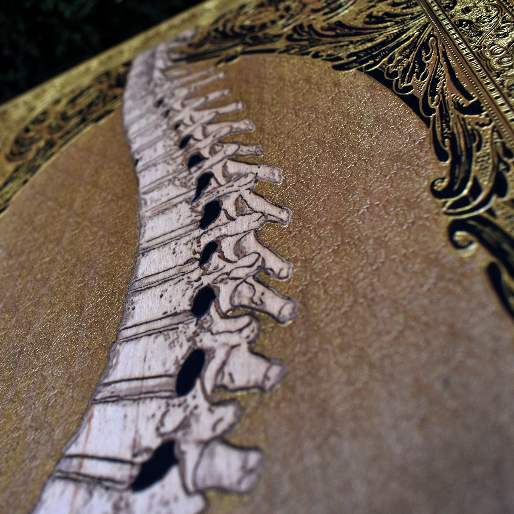 Dark art wood engraving featuring a gothic skull with gold inlays. Perfect for skull art lovers, gothic home styling, and alternative wall decor.