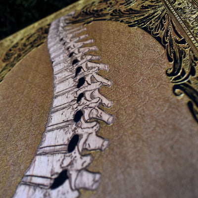 Dark art wood engraving featuring a gothic skull with gold inlays. Perfect for skull art lovers, gothic home styling, and alternative wall decor.