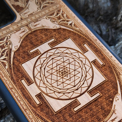 Wood phone case for iPhone & Samsung Galaxy featuring intricate Sri Yantra Chakra design. Laser-engraved with Gothic patterns, offering a unique, spiritual aesthetic. Slim, durable, and compatible with iPhone 15, 14, 13, 12, 11 Pro Max Mini & Samsung Galaxy S24, S23, S22, S21, S20 Ultra Plus Note 20. Stylish, protective, and personalized—order now!