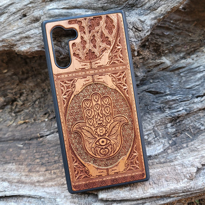 Hand-painted Hamsa Hand symbol wood phone case with Gothic pattern for iPhone & Samsung Galaxy. Laser-engraved design offers durability and style, compatible with iPhone , 15, 14, 13, 12, 11 Pro Max Mini & Samsung Galaxy S, S24, S23, S22, S21, S20 Ultra Plus Note 20.