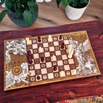Hand-painted and laser engraved wooden chessboard featuring Saint Michael the Archangel. Religious Christian artwork on natural wood with detailed engraving, handcrafted chess set for collectors and faith-inspired home decor.