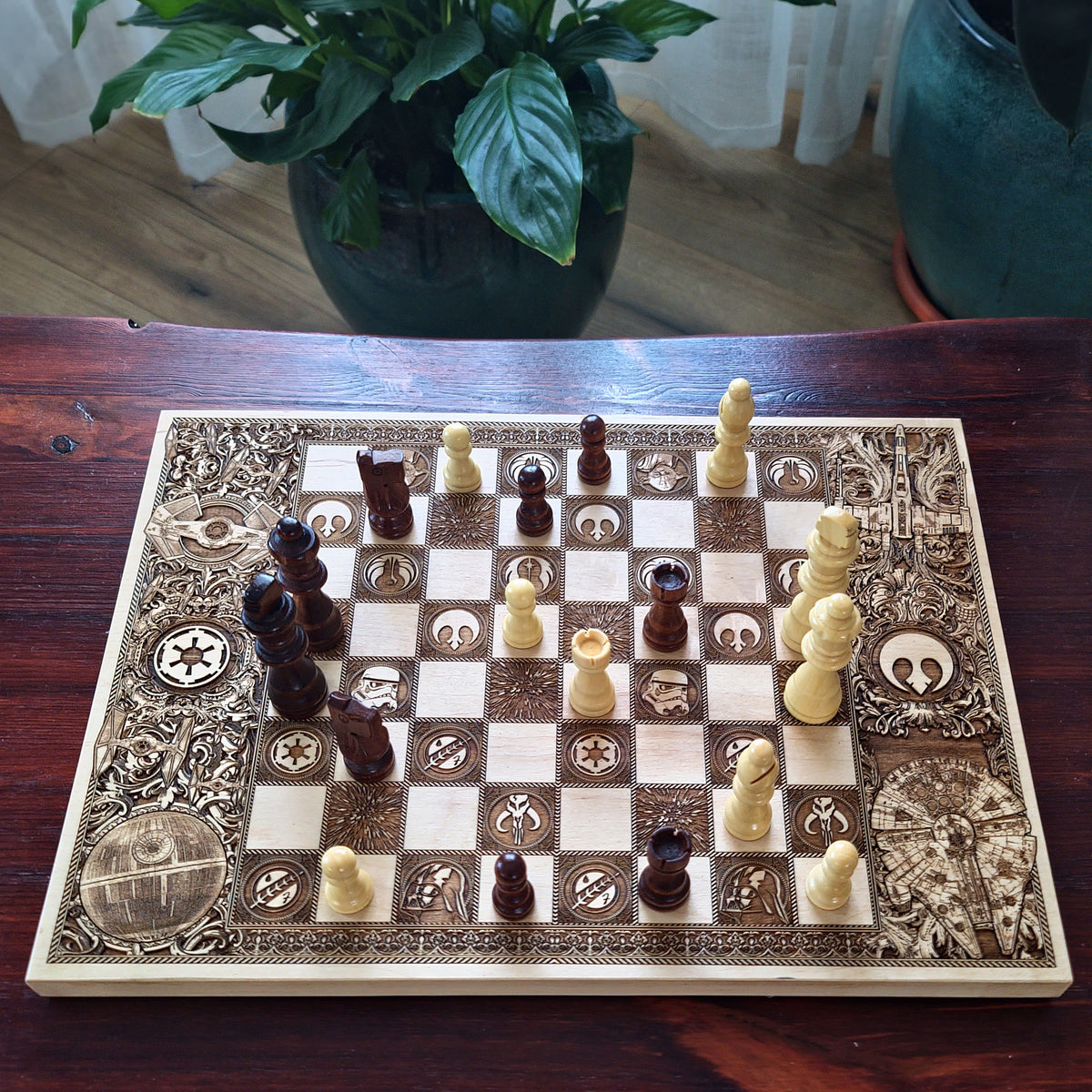 Detailed laser engraved sci fi chessboard with ornate space themed border and wooden chess pieces