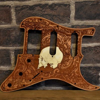 Fender Stratocaster cherry wood pickguard with laser-engraved skull design, handmade.