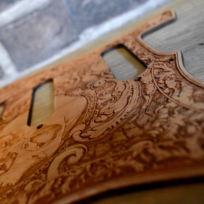 Custom cherry wood Fender Stratocaster pickguard with hand-finished engraving