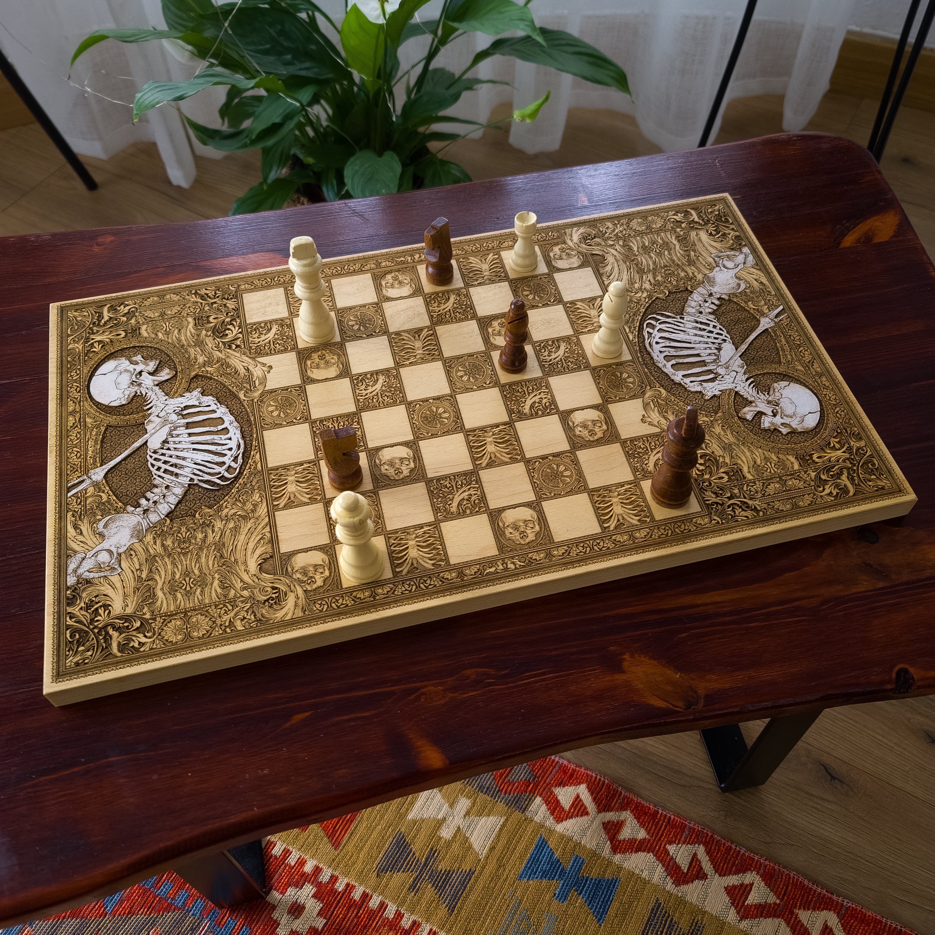 Wooden chessboard with laser-engraved and hand-painted skeleton designs