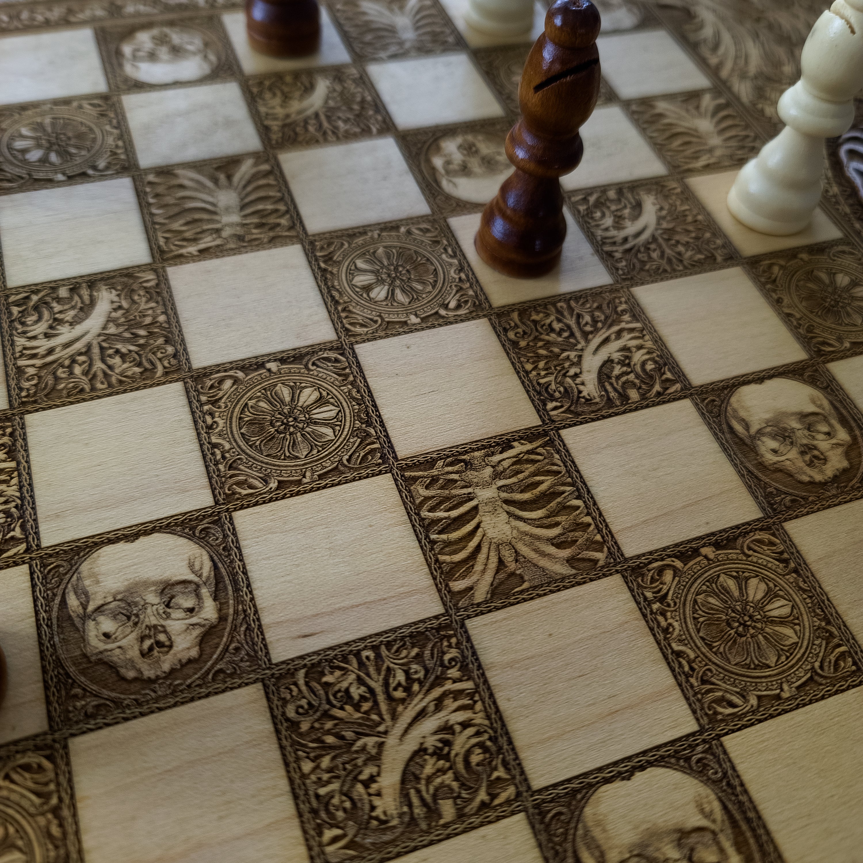 Chessboard featuring skulls, vertebrae, and anatomical engravings