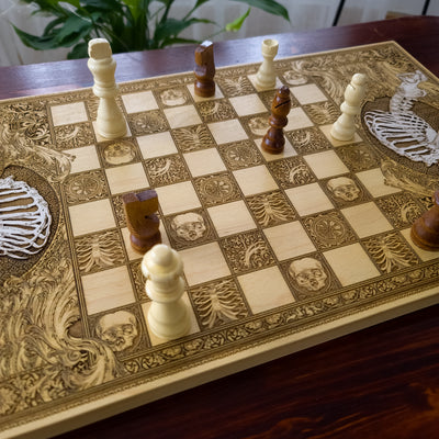 Artistic skeleton-themed wooden chessboard, hand painted