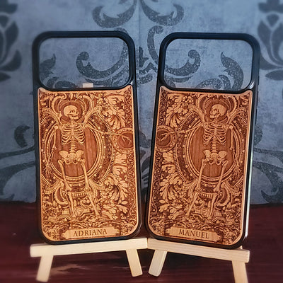Laser-engraved wooden phone case featuring a detailed love couple skeletons with custom names 