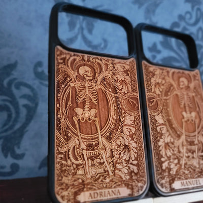 Laser-engraved wooden phone case featuring a detailed love couple skeletons with custom names 