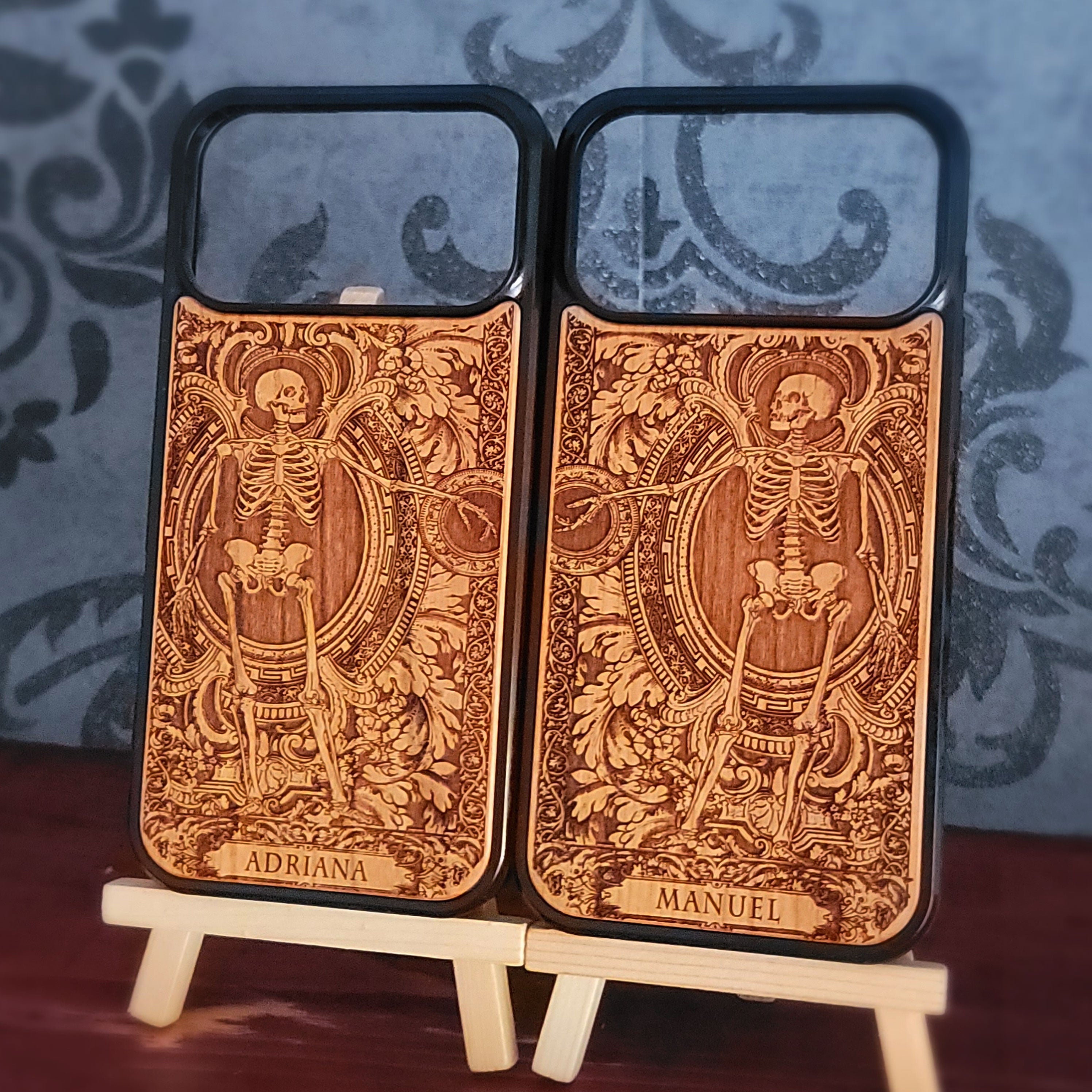 Laser-engraved wooden phone case featuring a detailed love couple skeletons with custom names 