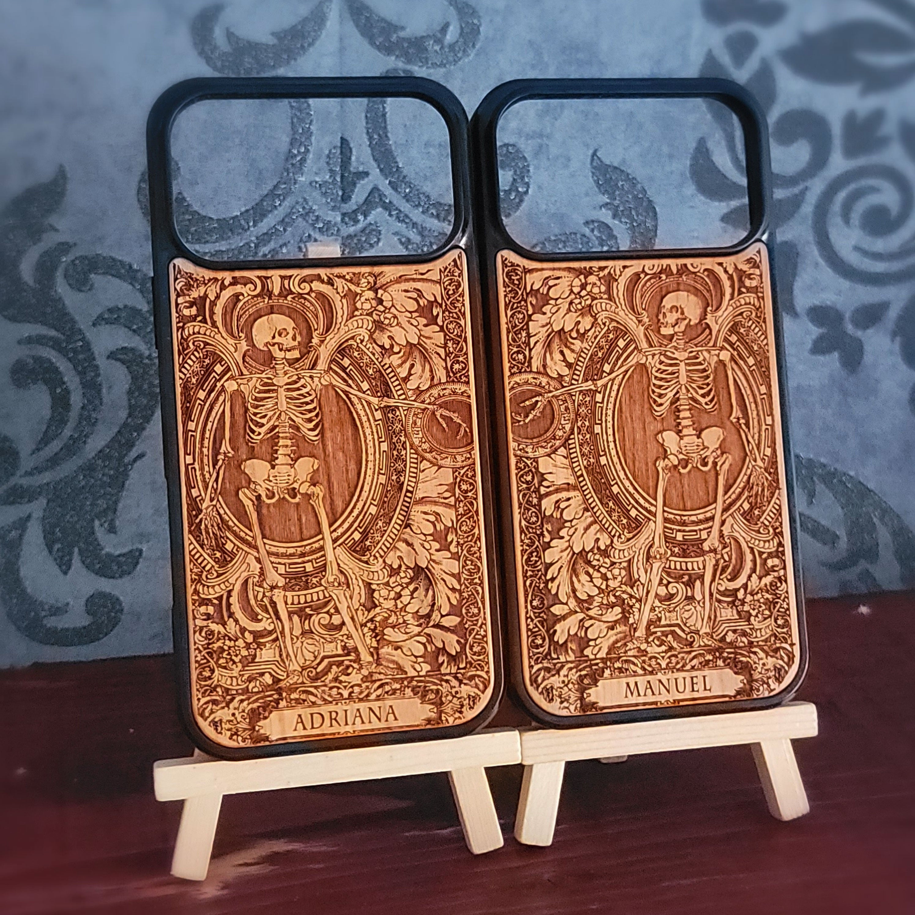 Laser-engraved wooden phone case featuring a detailed love couple skeletons with custom names 
