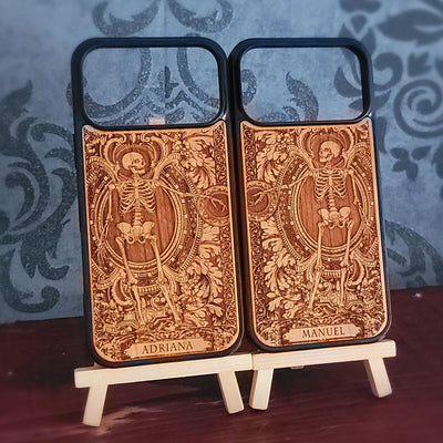 Laser-engraved wooden phone case featuring a detailed love couple skeletons with custom names 