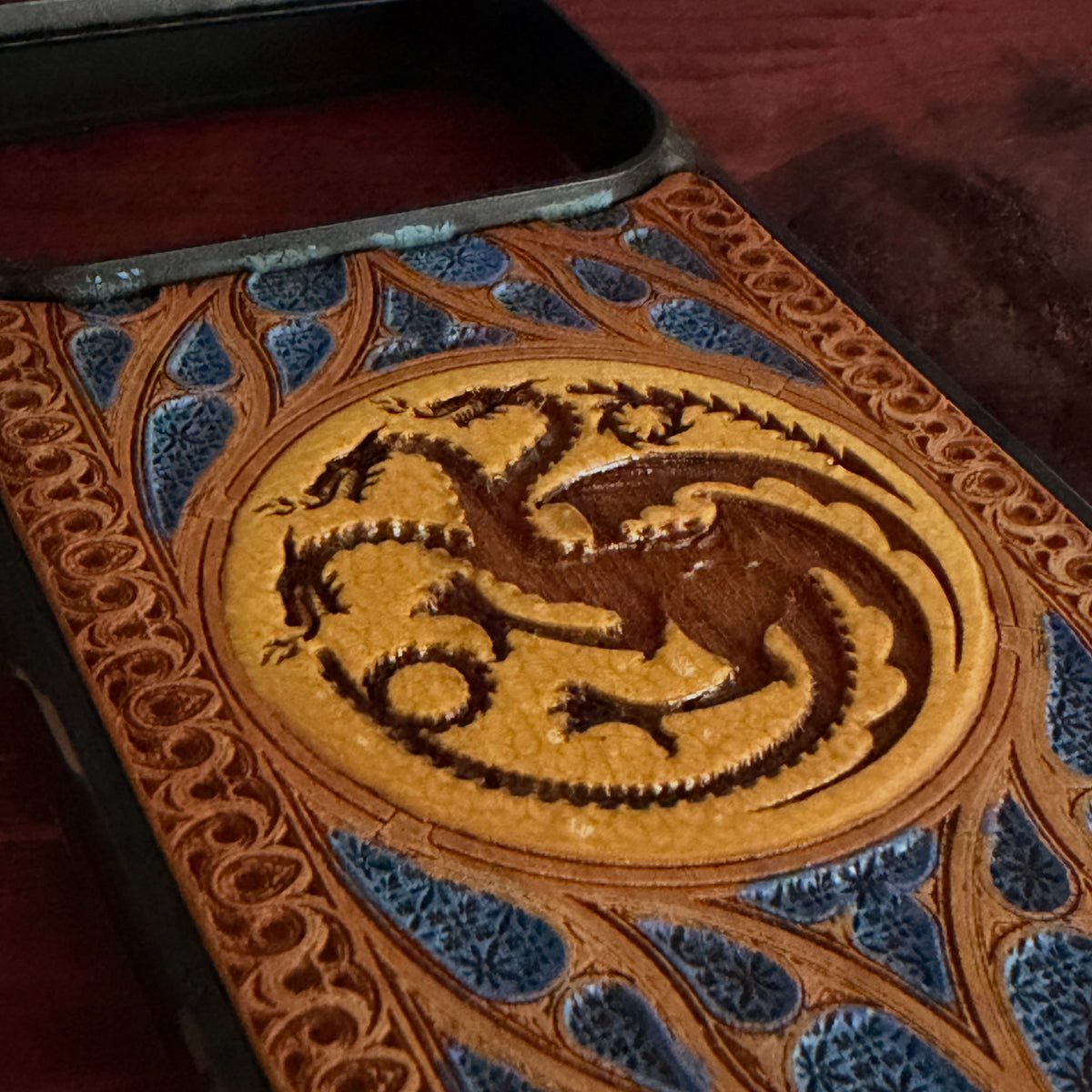 Targaryen dragon crest wood phone case with gold emblem and blue gothic ornamental details