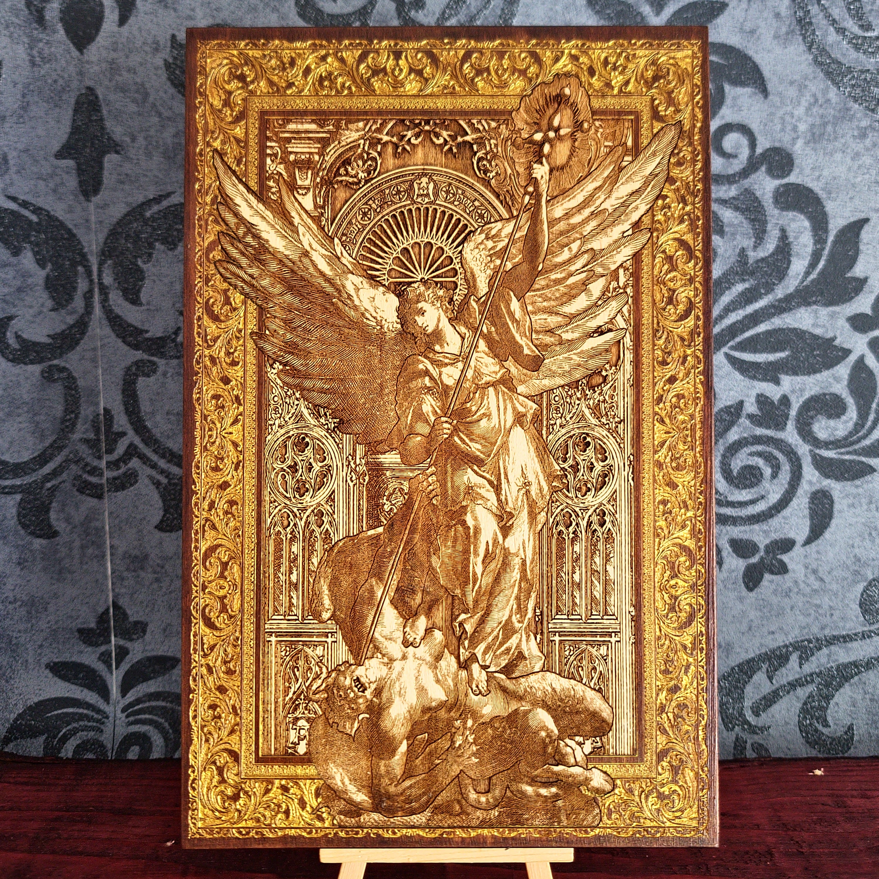 Saint Michael the Archangel engraved wood wall art with protector angel defeating evil in detailed Gothic Christian design