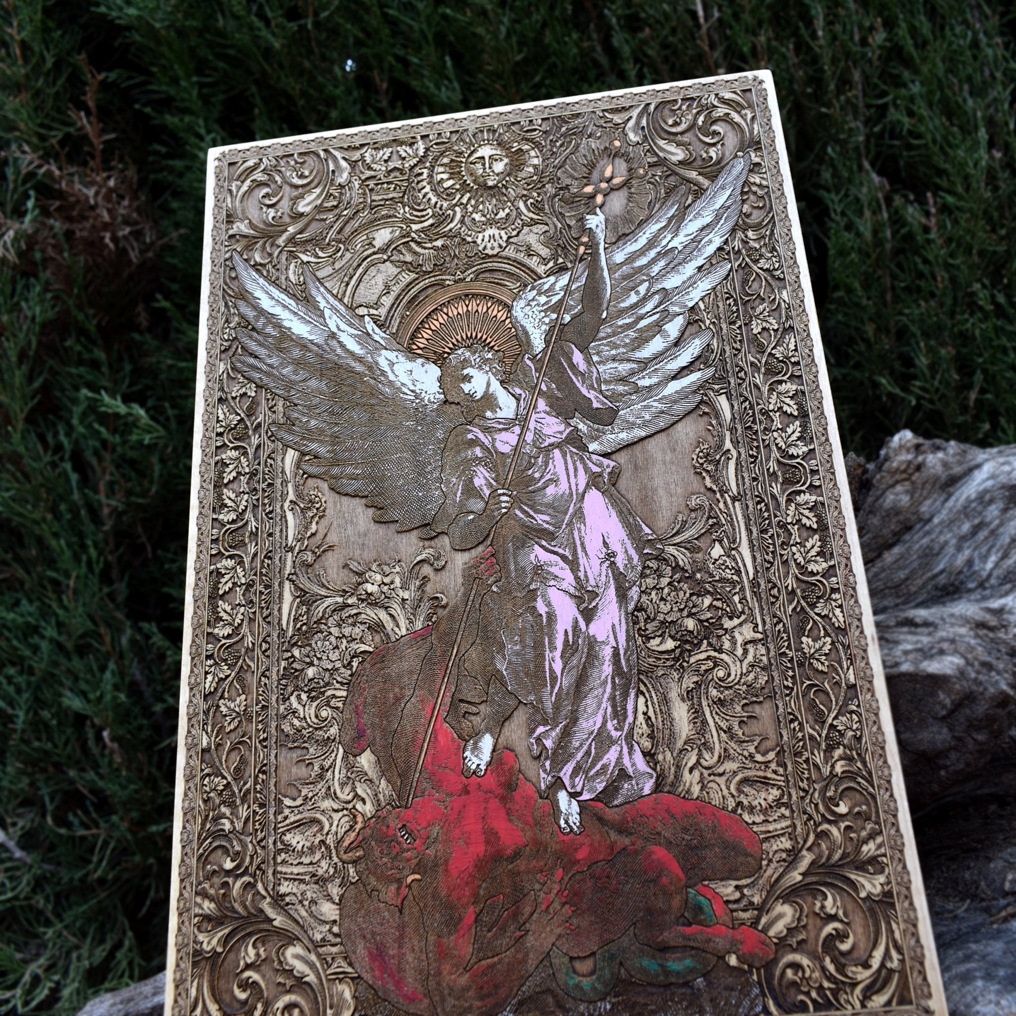 Handcrafted wood wall art of Saint Michael slaying the devil.