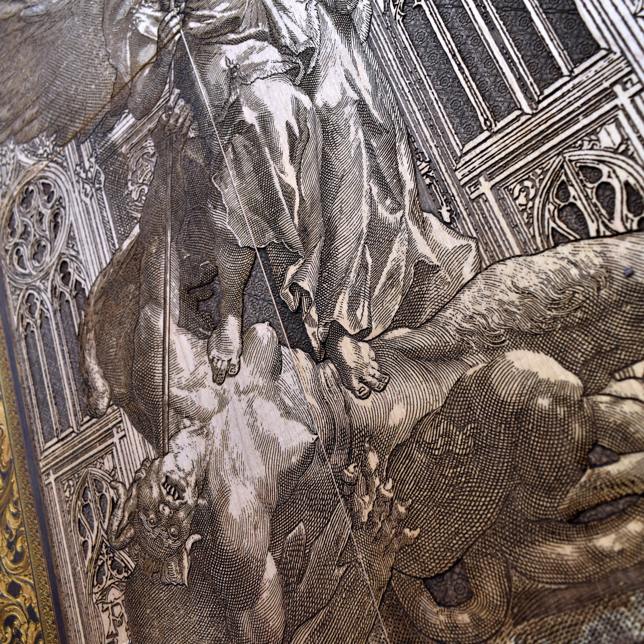 A detailed look at St. Michael’s wings and armor, showcasing expert craftsmanship in the wood engraving.